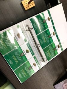 One of the binders available to patients, showing the different strains and effects of various cannabis.
