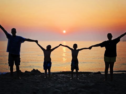 A family enjoying a sunset