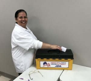 A TQ Baking member casting a vote at the contract ratification meeting on 10/23/2019.
