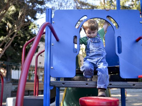 A child playing on a playground.