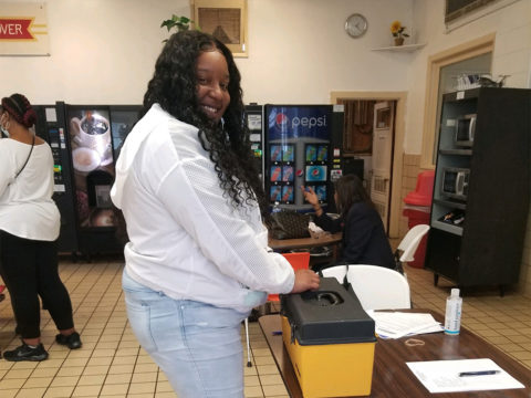 Tyshika Hayes, a member at Hanover Foods in Clayton, DE voting at the contract ratification meeting.
