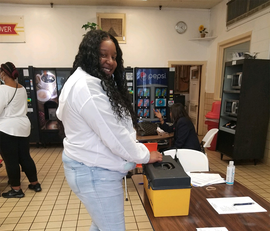 Tyshika Hayes, a member at Hanover Foods in Clayton, DE voting at the contract ratification meeting.