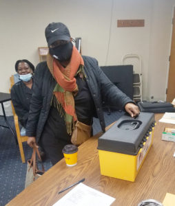 A member from Southgate Health Care Center voting at the ratification on 3/4/2021.