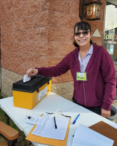 Shop Steward Lucy Maldonado voting at the Spring Oak ratification meeting.