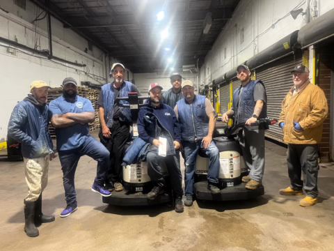 The workers at Lawrence Street Seafood at the contract ratification meeting, 2025.